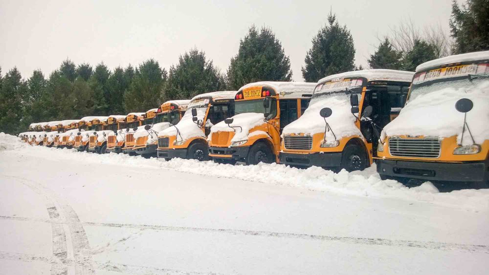 Snow Covered School Bus Lot